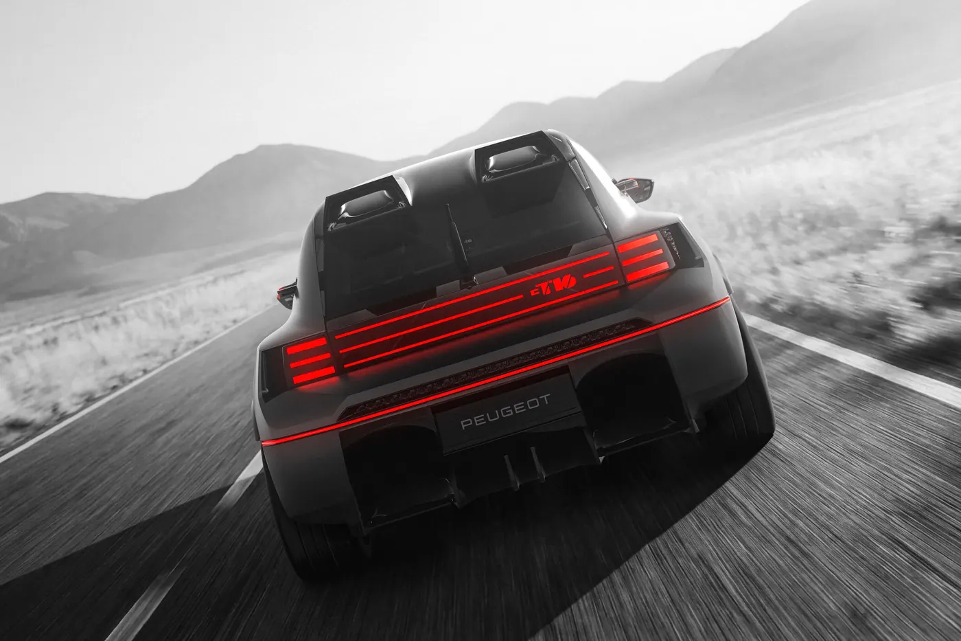 Rear view of the Peugeot E-T16 Concept on the move, with horizontal red light bars and a split rear wing.