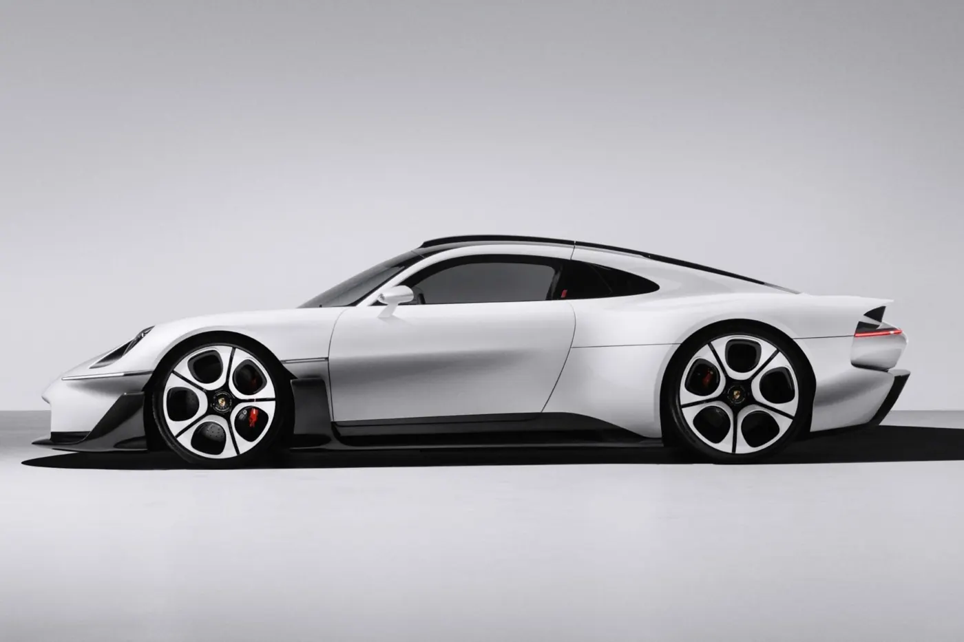 Porsche Mission S concept in side profile, with white body, black roof and white-faced wheels