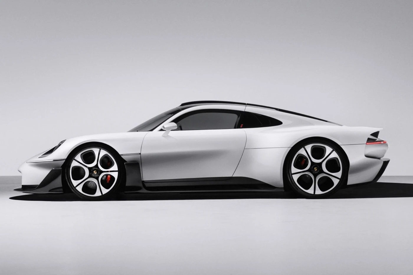 Porsche Mission S concept in side profile, with white body, black roof and white-faced wheels