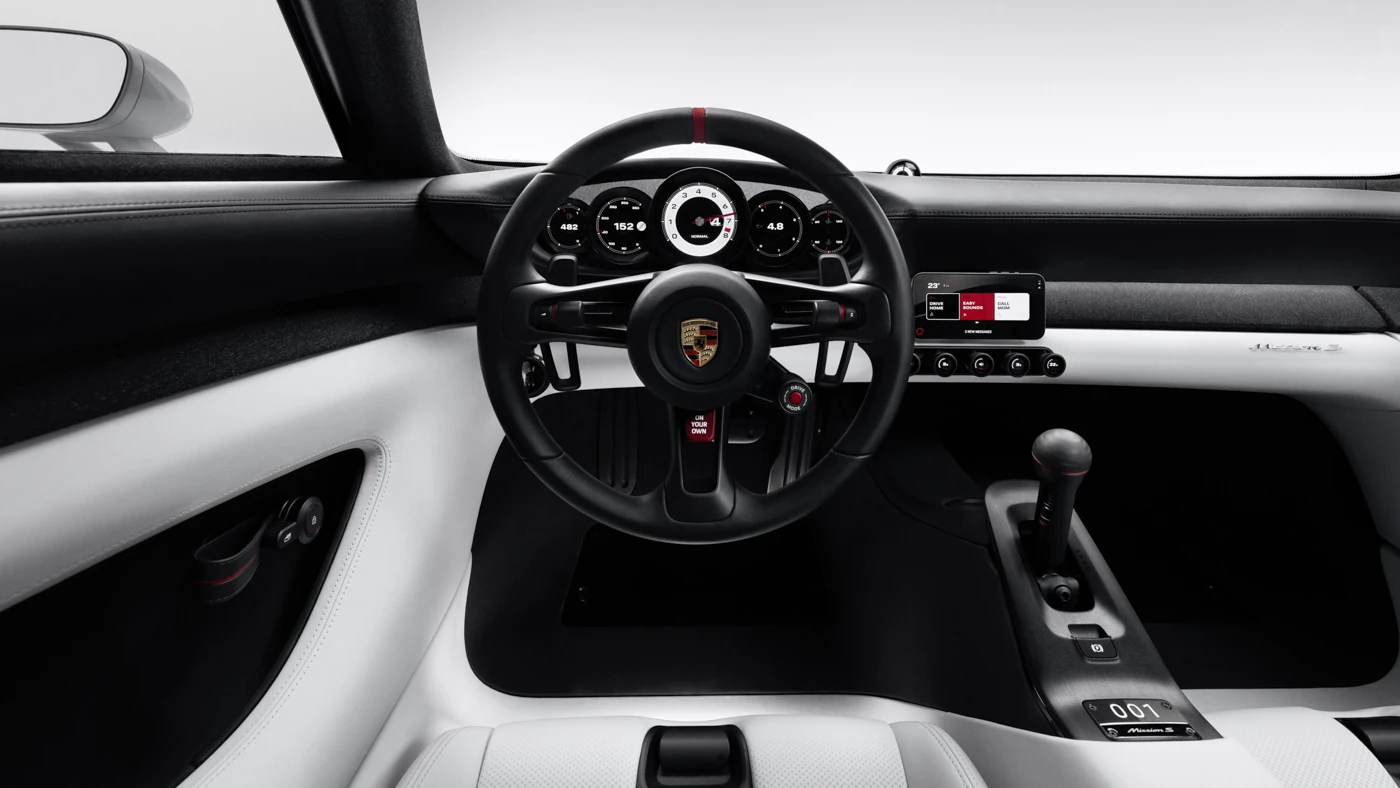 Mission S dashboard straight ahead, with steering wheel, five-dial cluster, small centre screen and tall gear lever