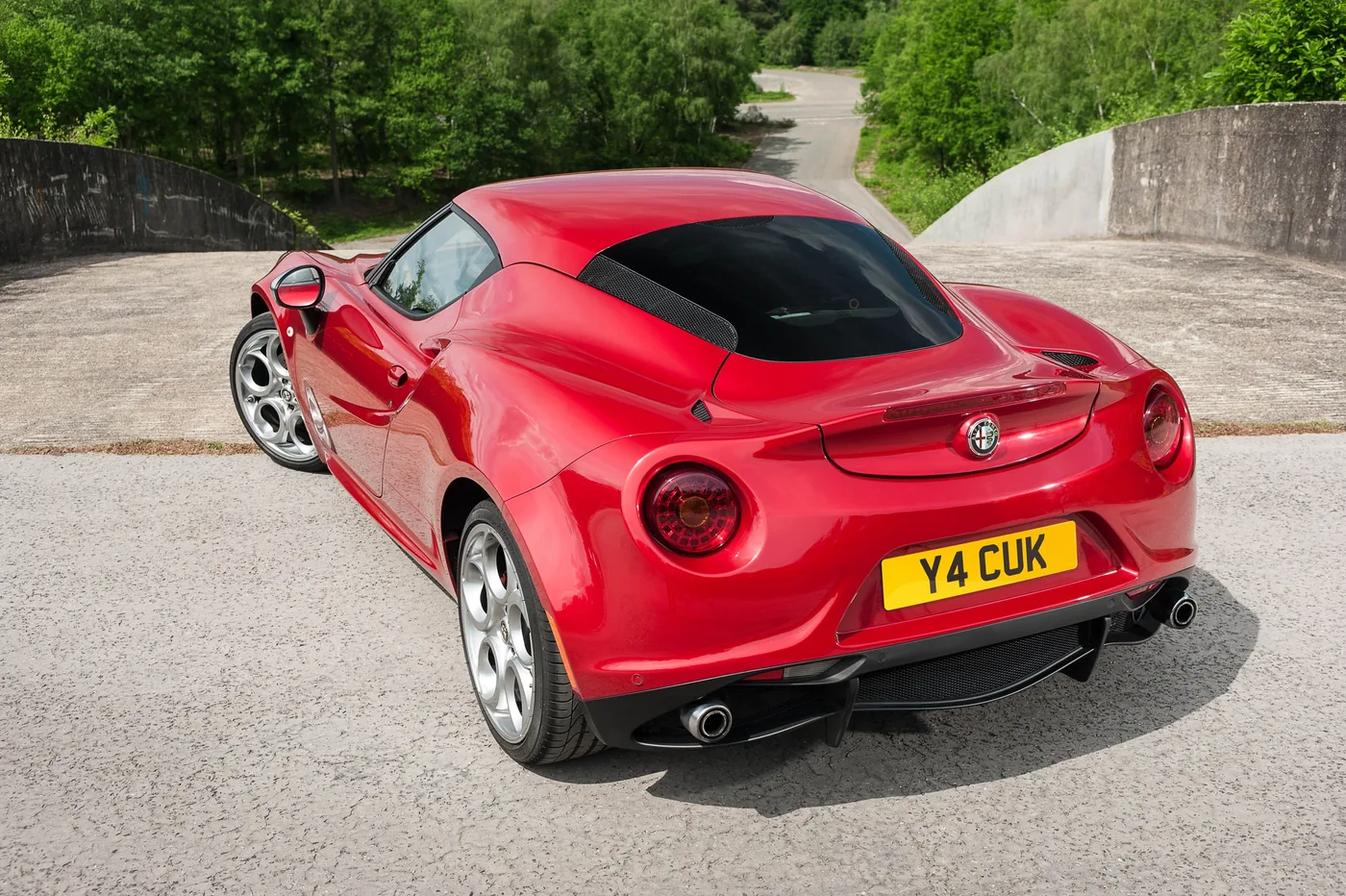 High angle rear three quarter static shot of a red Alfa Romeo 4C - Rush magazine buyer's guide