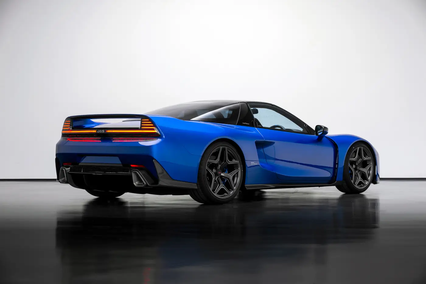 JAS Tensei: rear three-quarter metallic blue studio setting