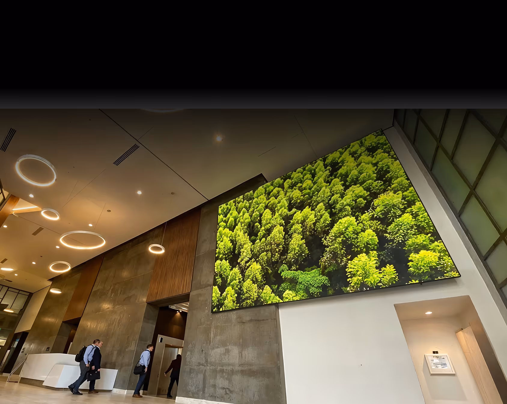 A large picture hanging on the wall of a building.