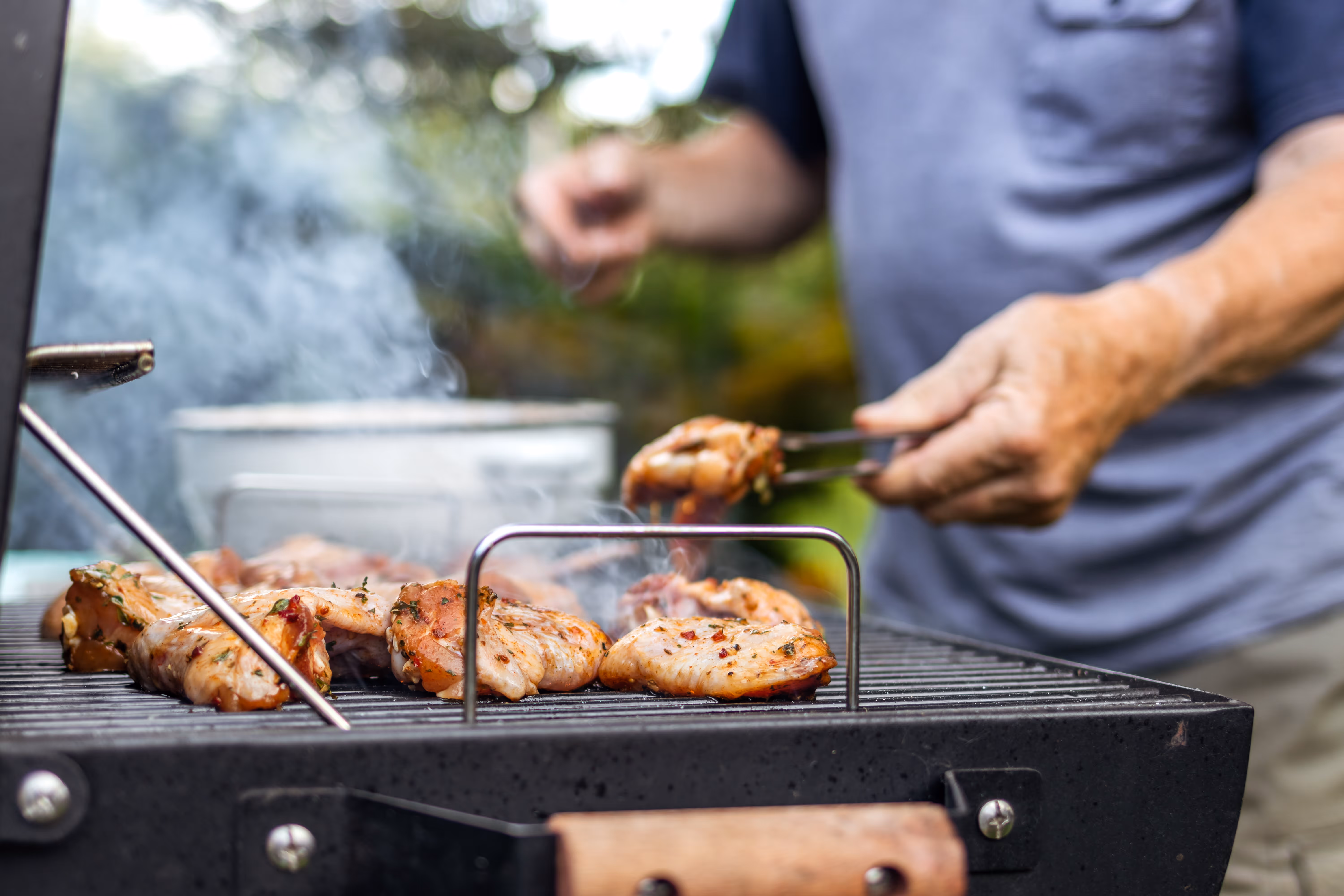 man grilling on BBQ Grill stock image