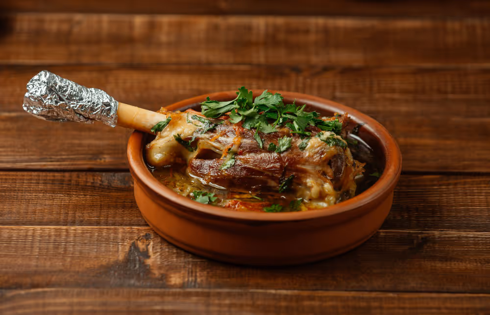 A bowl of food with a spoon in it.