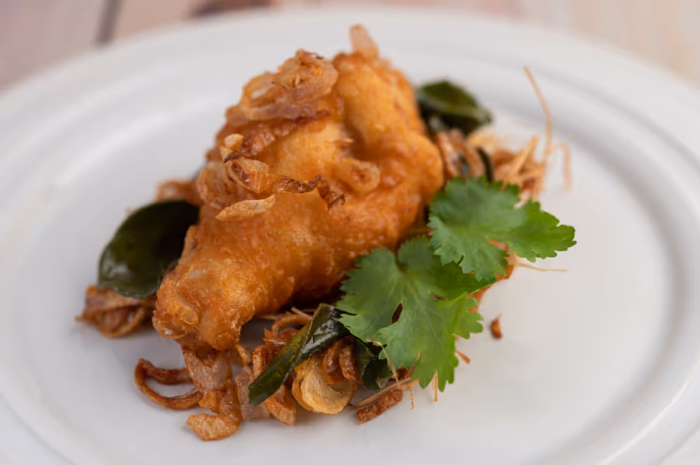 A plate with a piece of food on it.