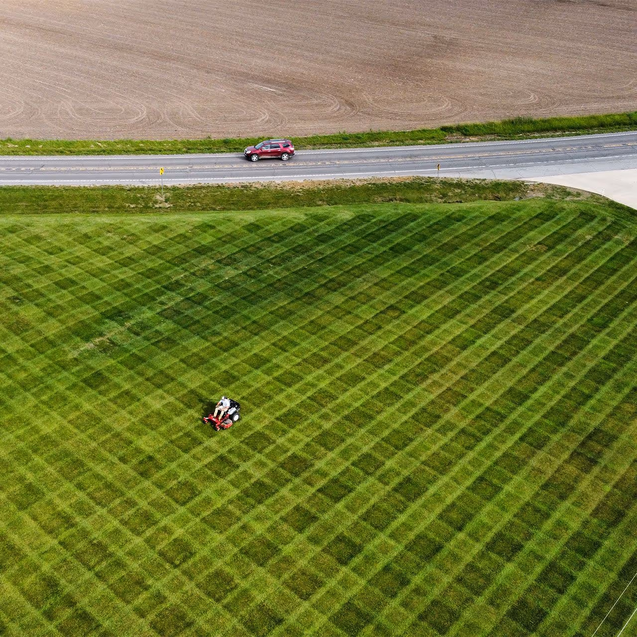 weekly lawn mowing and trimming service near me by Landmark Lawncare