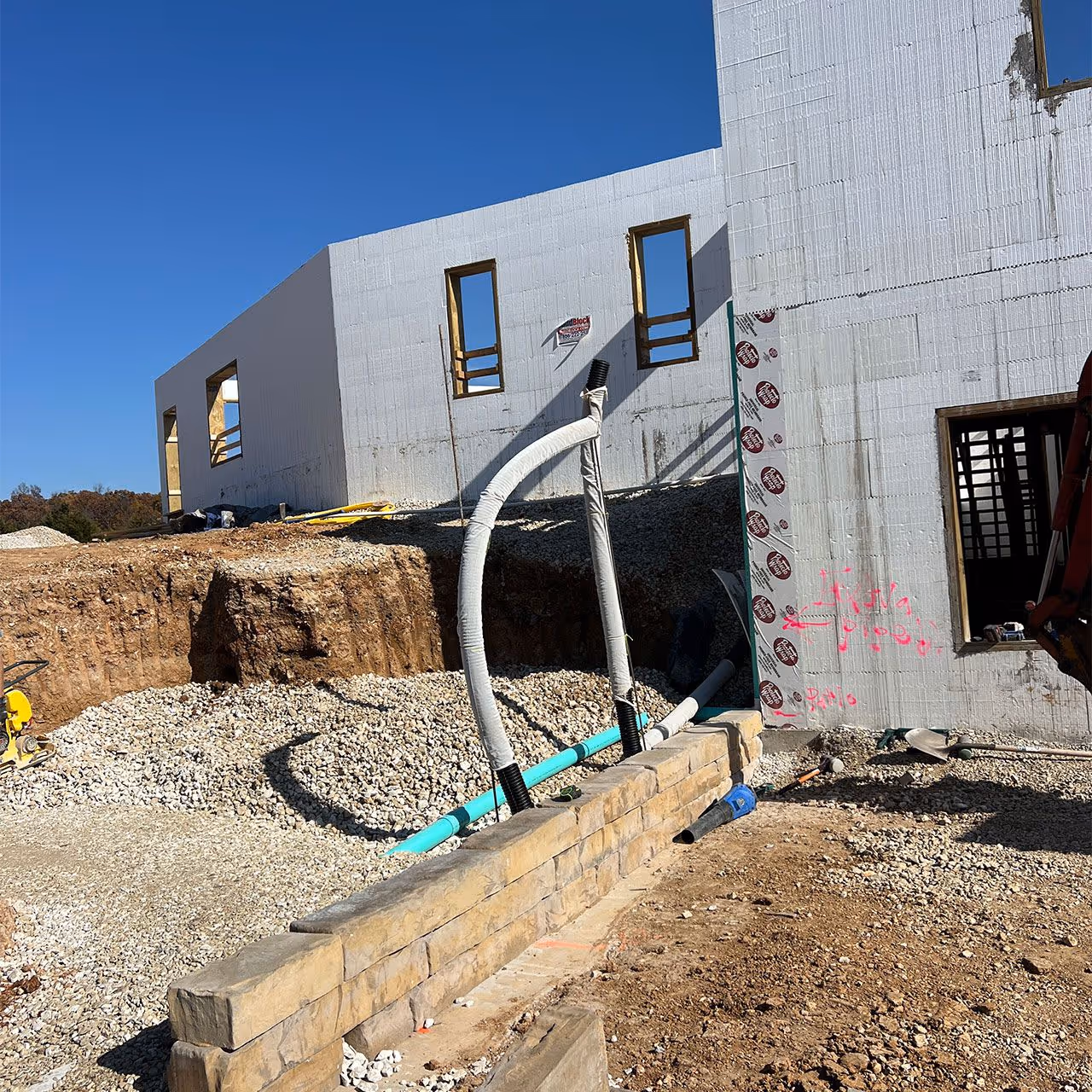 stone retaining wall and patio hardscaping by Landmark Lawncare Lake of the Ozarks Missouri