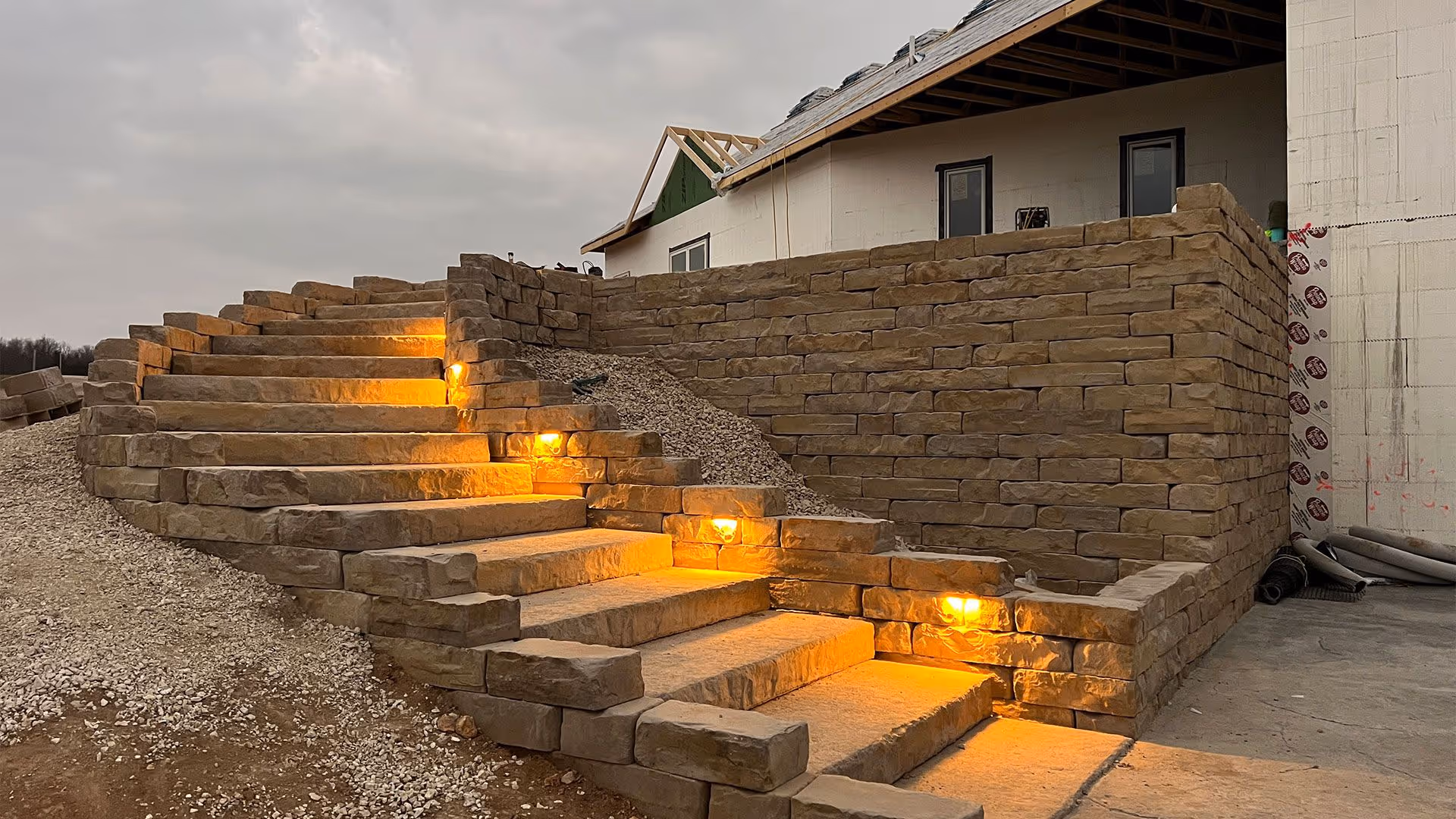 retaining wall and stairs hardscape construction by Landmark Lawncare