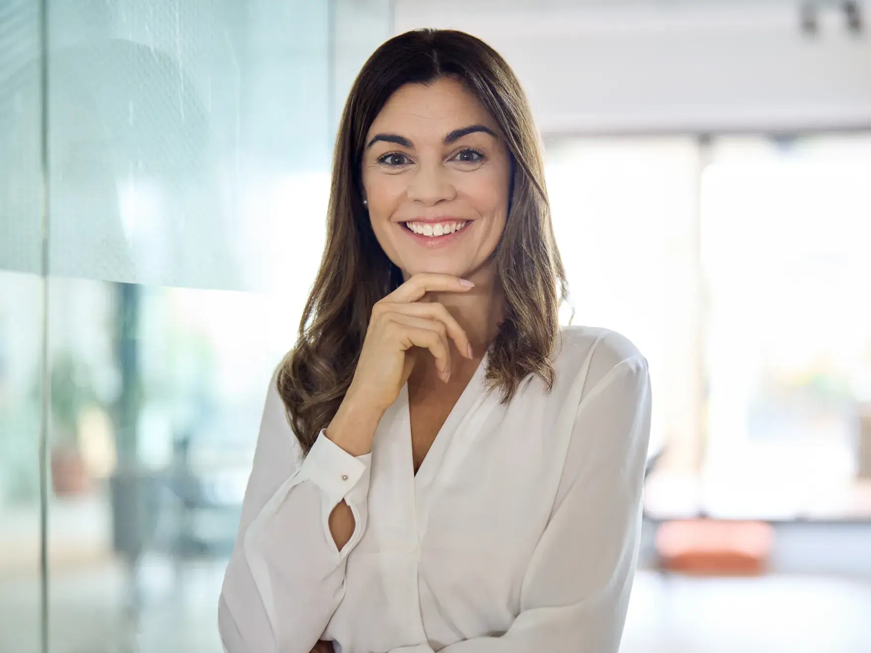 a woman in a white shirt posing for a picture