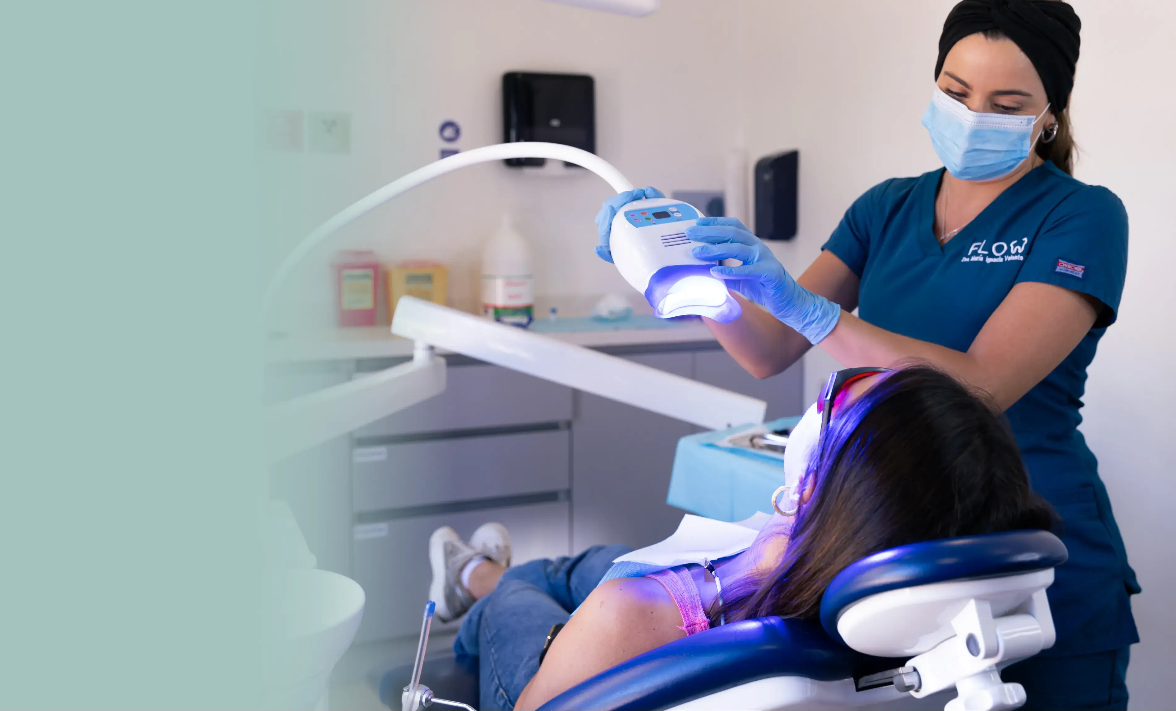 a woman getting her teeth checked by a dentist