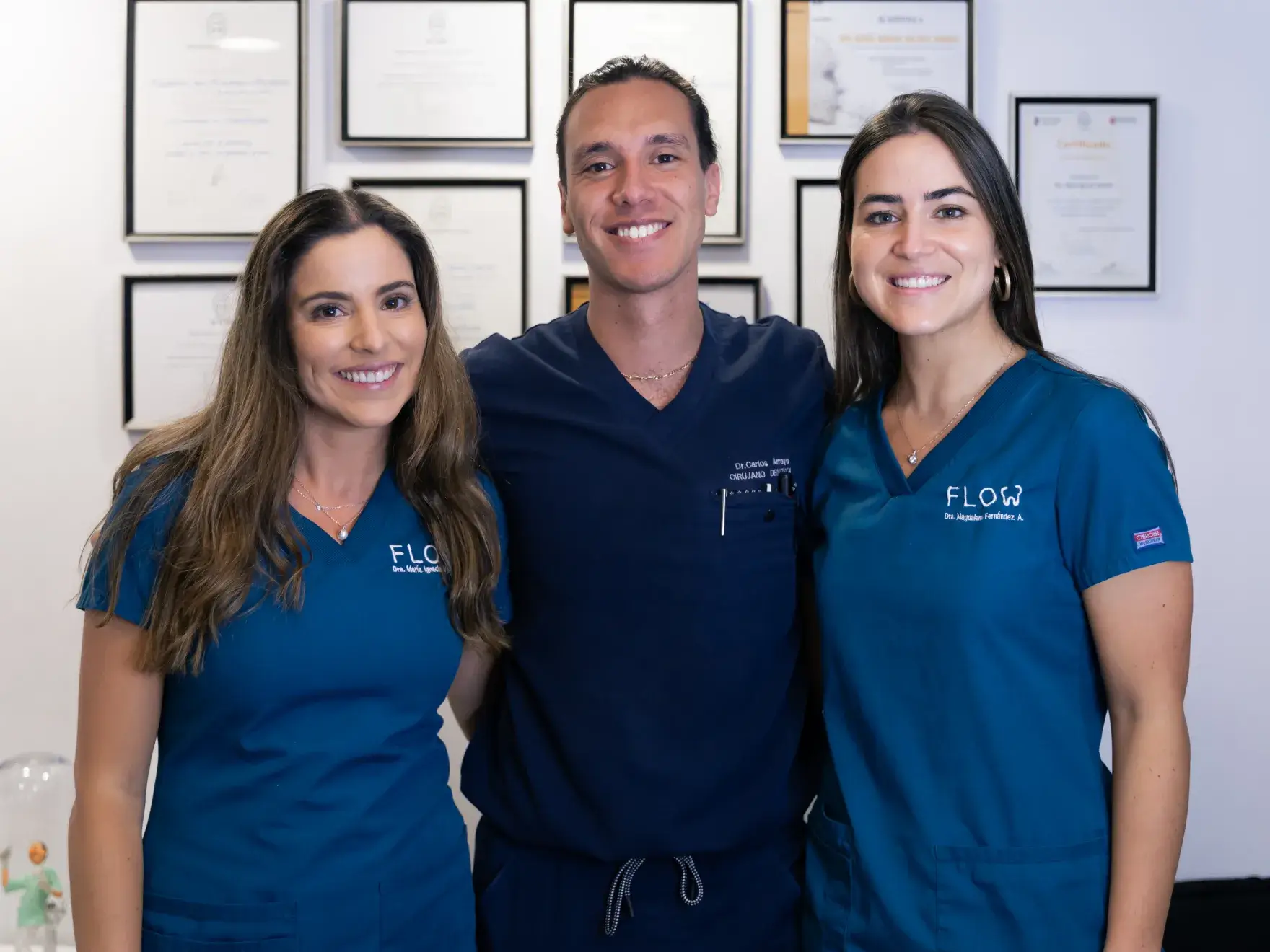 a man and two women standing next to each other