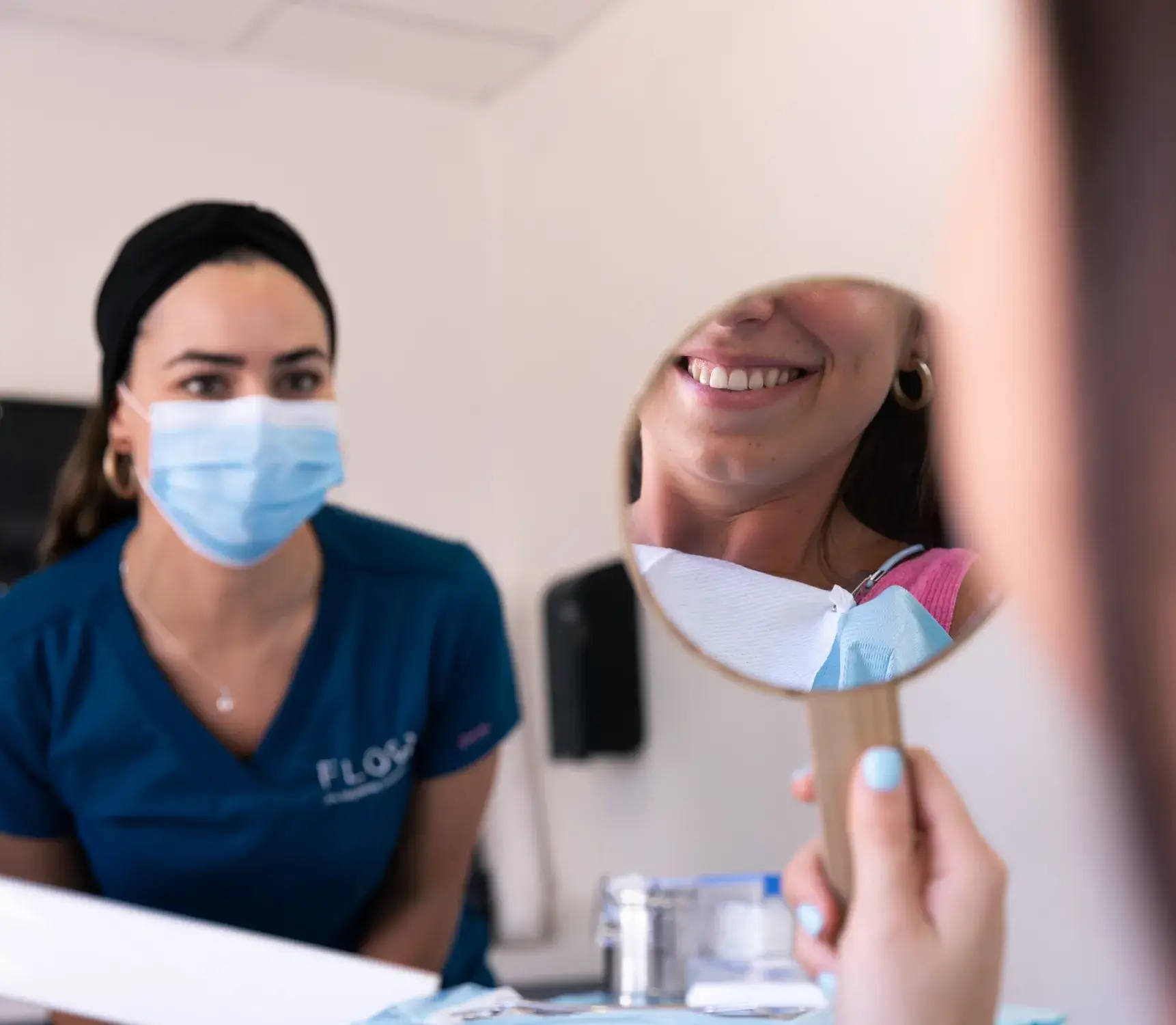 a woman in a blue shirt and a woman in a blue shirt wearing a face