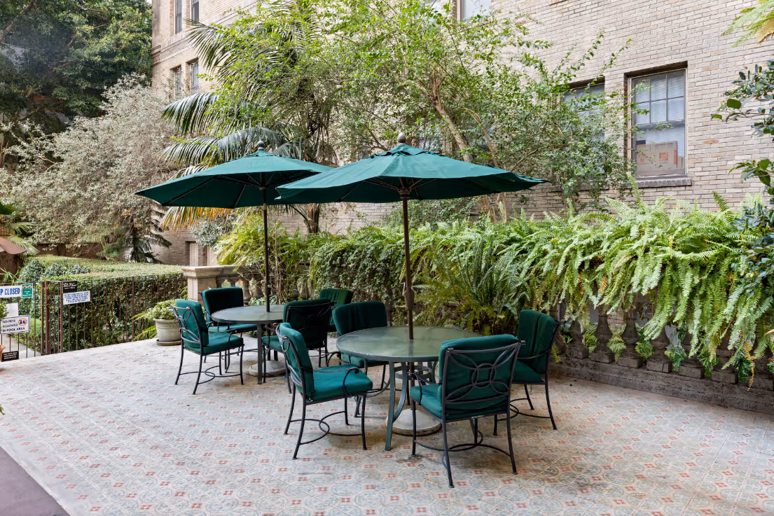 patio with tables with umbrellas