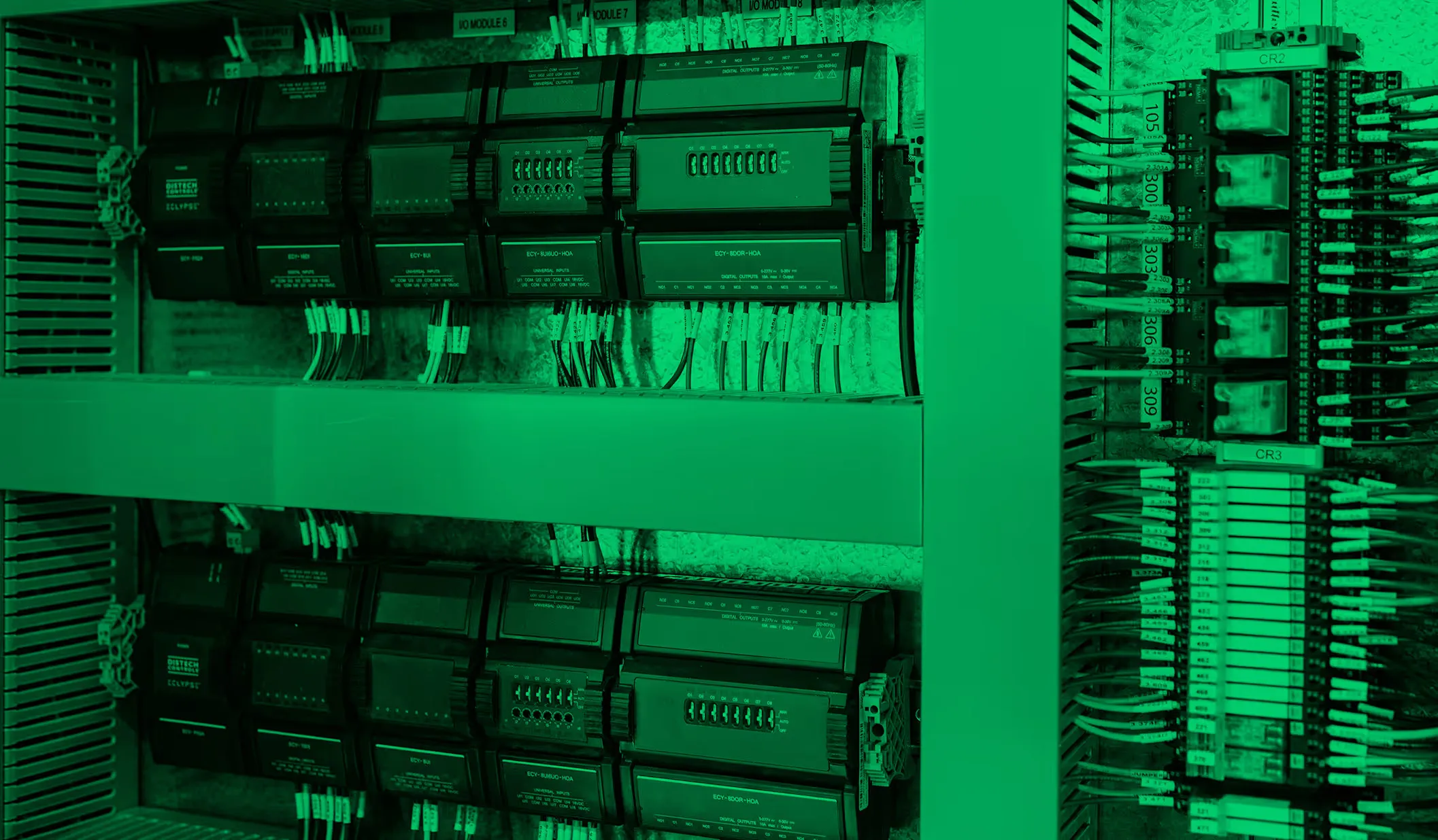 Open electrical control panel with switches and labeled power supply boxes.