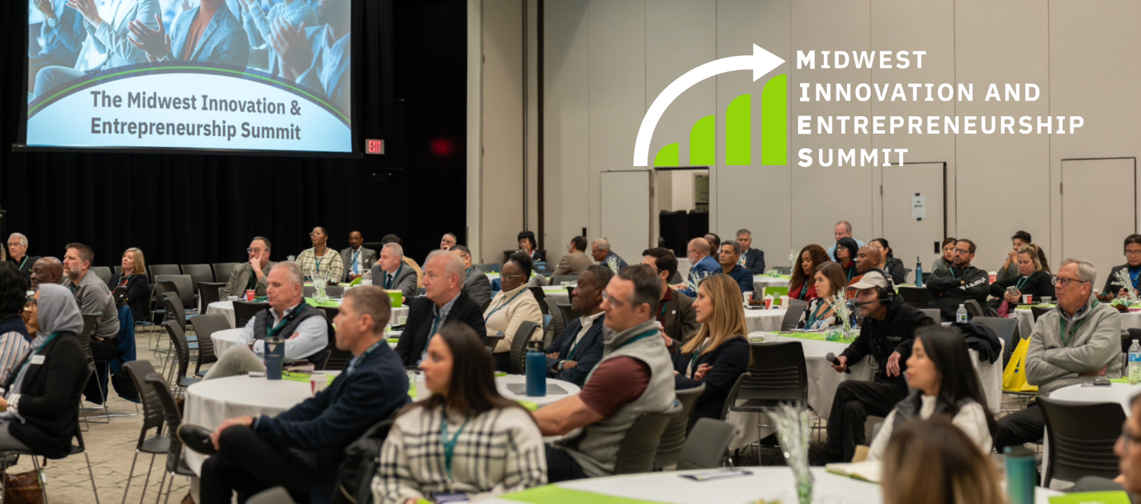 Audience seated at round tables listening to a presentation at The Midwest Innovation & Entrepreneurship Summit.