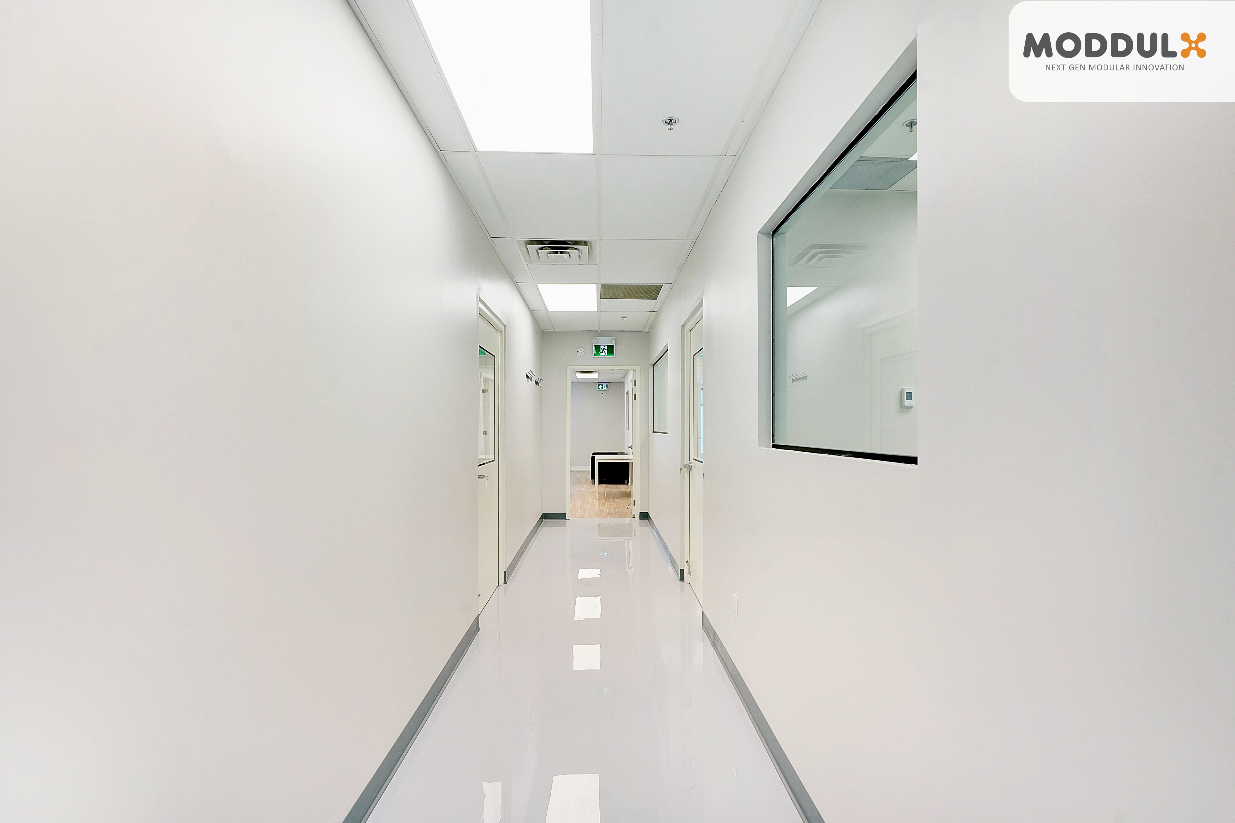 completed ISO 14644 modular cleanroom interior seamless white wall panels GMP pharmaceutical facility Ontario