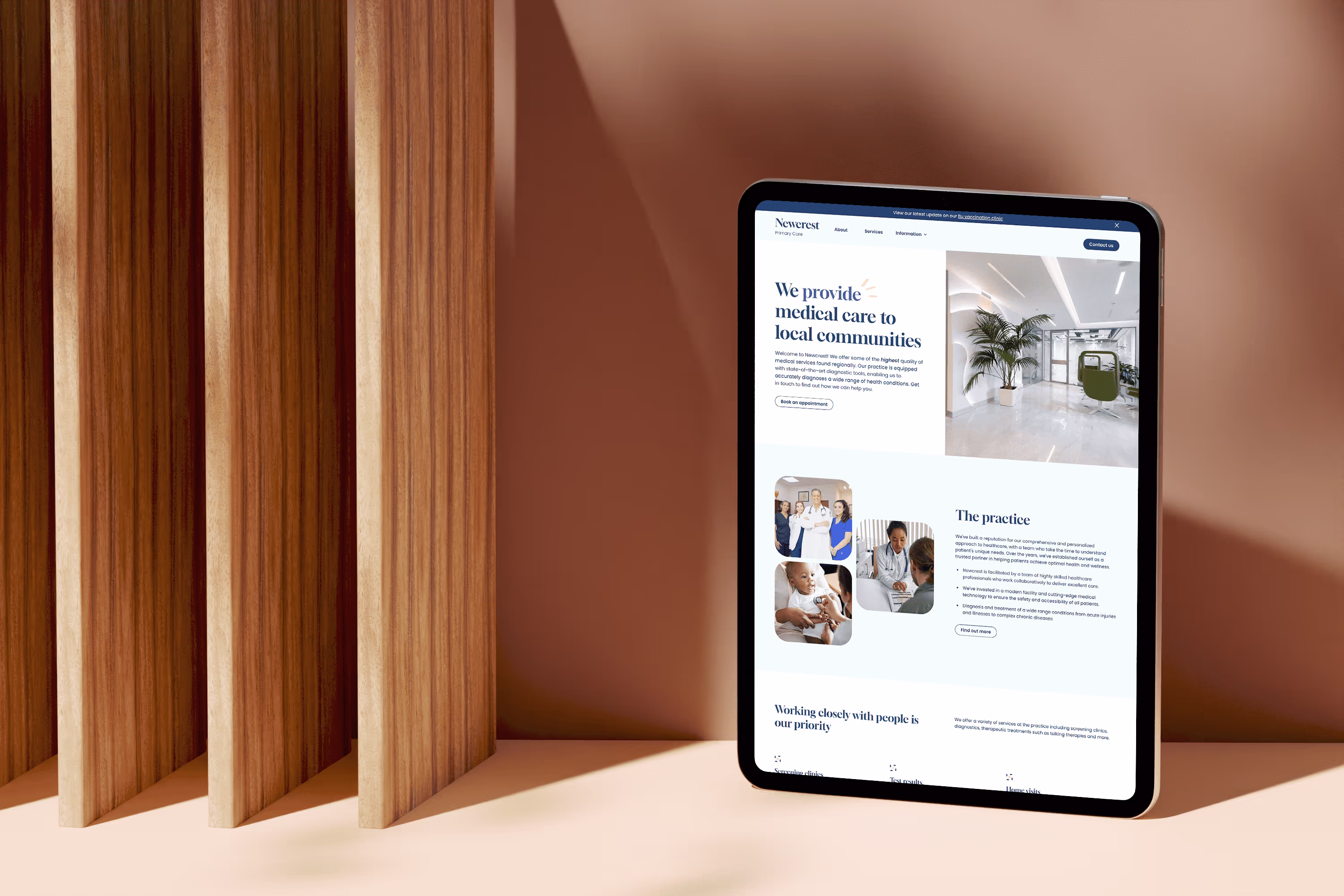 Tablet resting on a beige wall