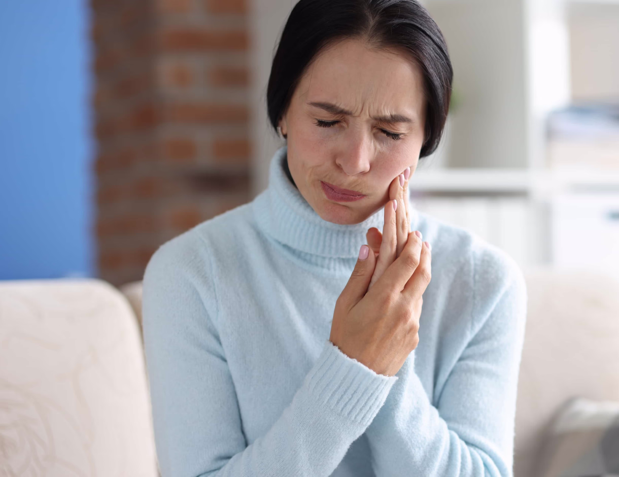 Woman with toothache needs emergency dental care in West San Jose