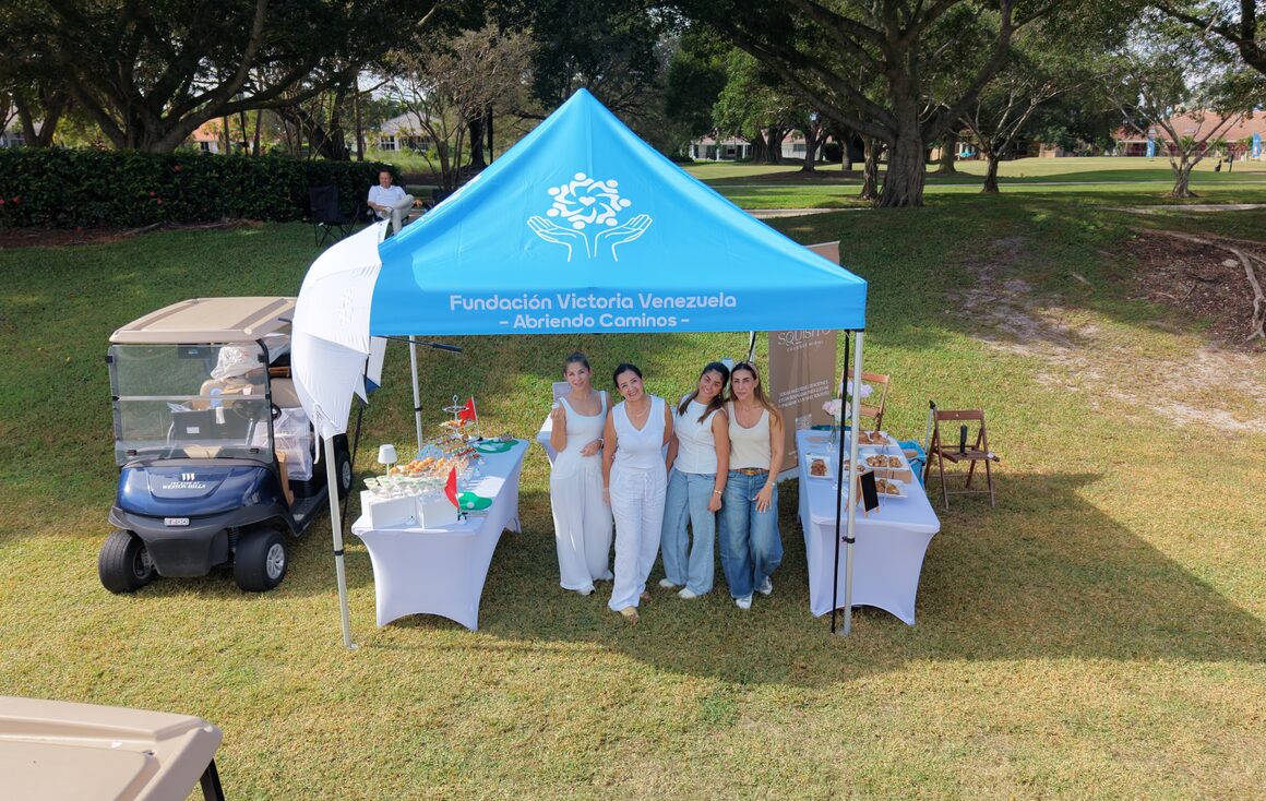 The Victoria Venezuela Foundation tent on the course at the 2025 charity golf tournament.