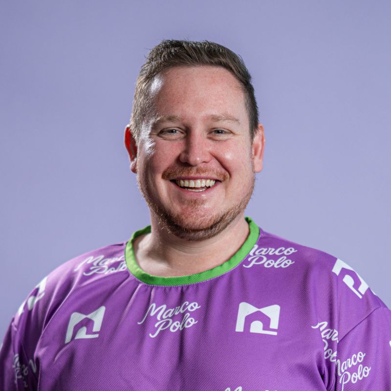 Profile picture of Aaron Cotton, Co-founder of Marco Polo Portal, wearing a purple Marco Polo shirt, with a lavender coloured background