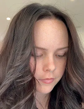 Seamless cool brunette tint colour result on smooth mid-length hair at Jura Draco salon