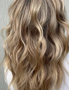 Dimensional blonde balayage waves showing natural root melt and honey tones at Jura Draco Gold Coast