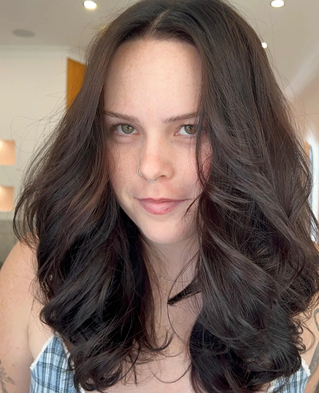 Rich chocolate brown full tint colour on long wavy hair styled at Jura Draco salon in Labrador, Gold Coast