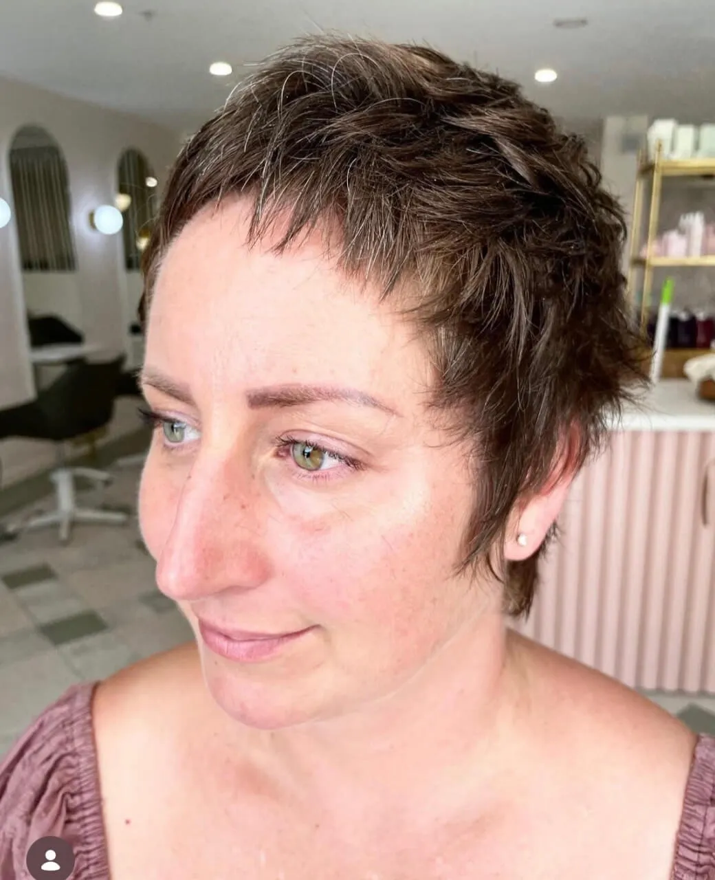 Textured pixie cut on short brunette hair at Jura Draco salon in Labrador, Gold Coast