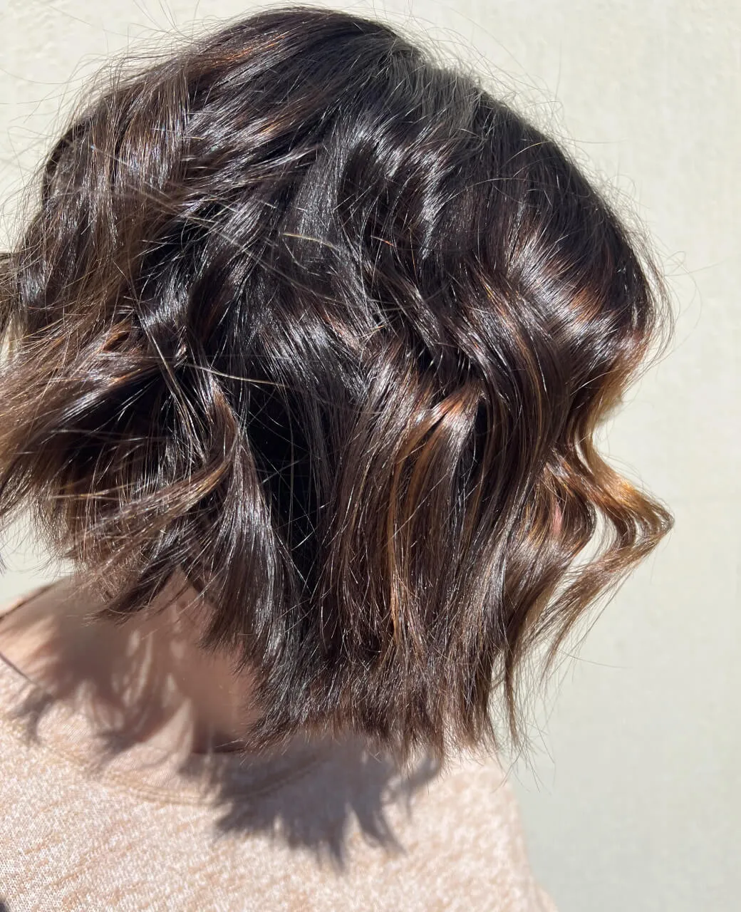 Textured wavy bob haircut on dark brunette hair styled at Jura Draco Gold Coast hair salon