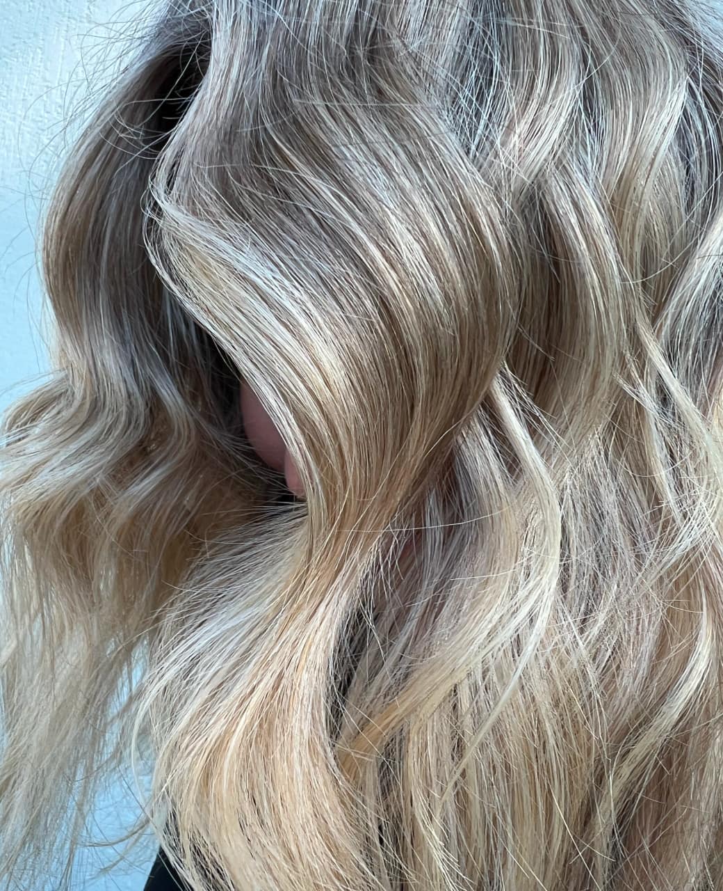 Cool-toned blonde balayage waves with dimensional foil highlights at Jura Draco Gold Coast blonde specialists