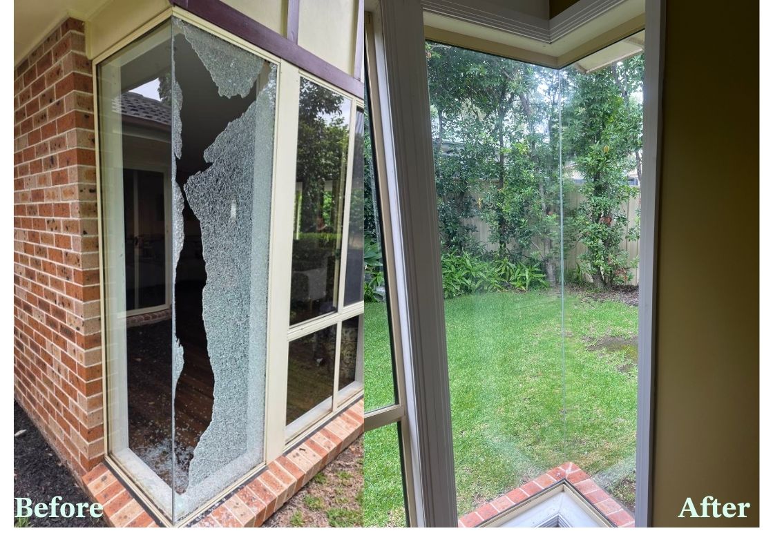 Three workers on an orange scissor lift in front of a building with large glass windows, a black banner reading 'Panther Glass' with a panther logo is attached to the lift.