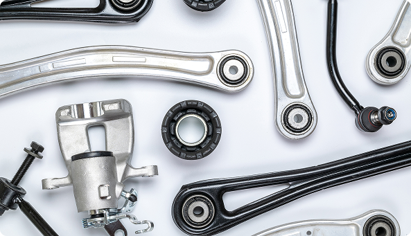 Photos of multiple car parts, laying on a table.