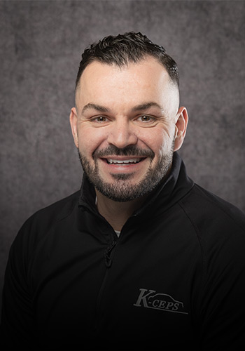 Professional headshot of Adam Speck, partner and COO of K-ceps.