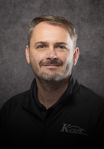 Professional headshot of Chris Speck, partner of K-ceps.