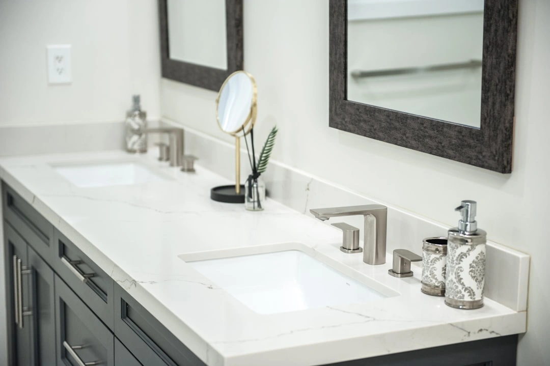 modern bathroom vanity with clean fixtures and clear drain - how to prevent drain clogs in your home