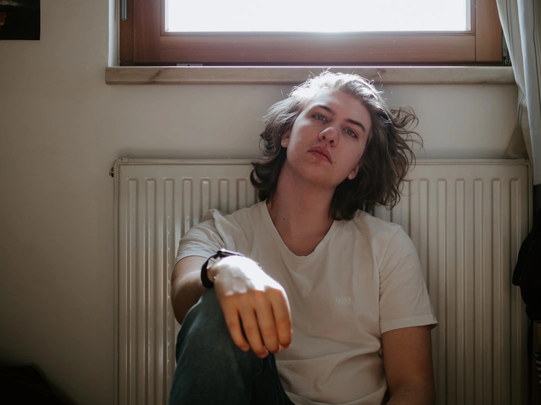 person feeling sticky and warm indoors despite the air conditioning running