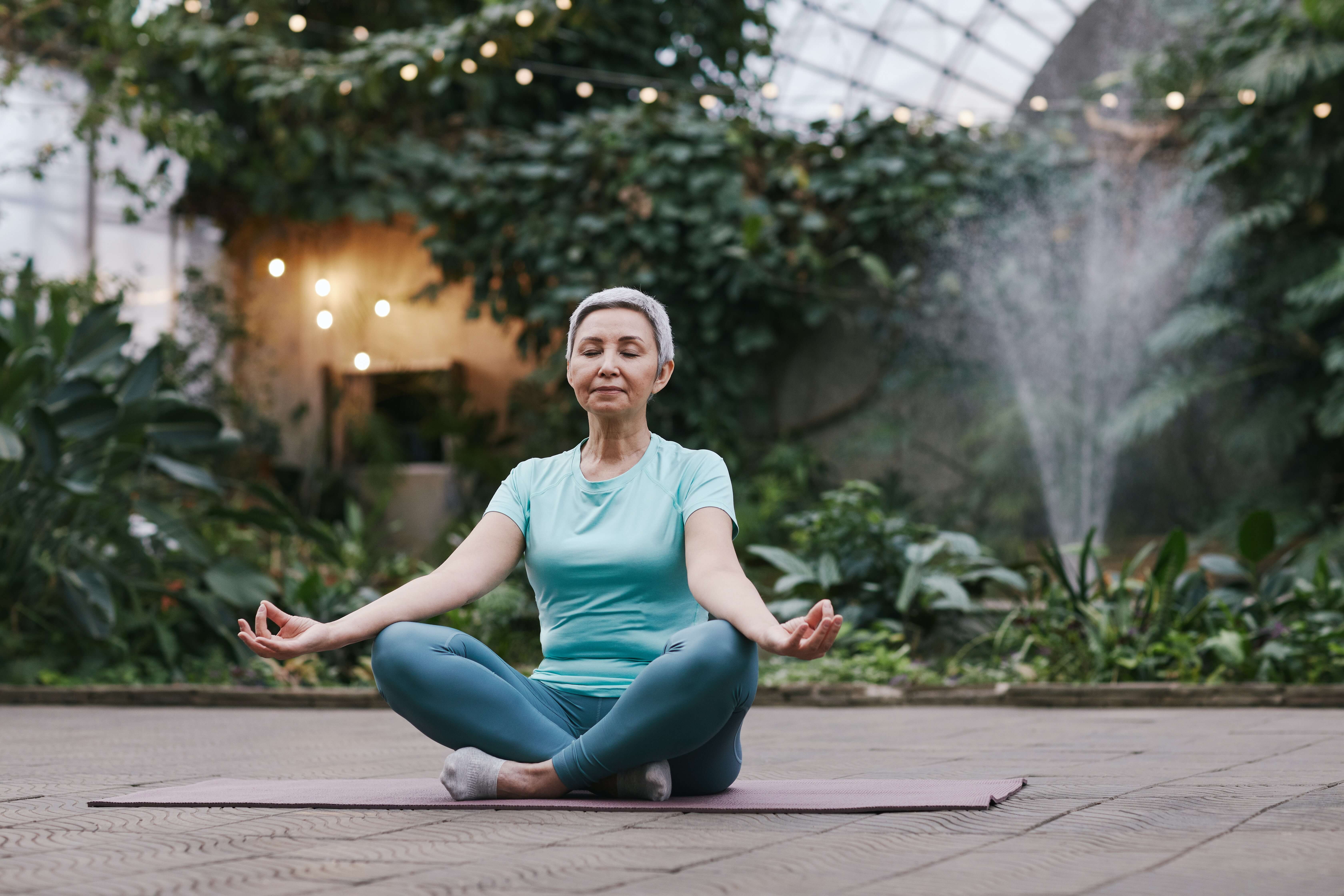 Healthy woman relaxing in a garden