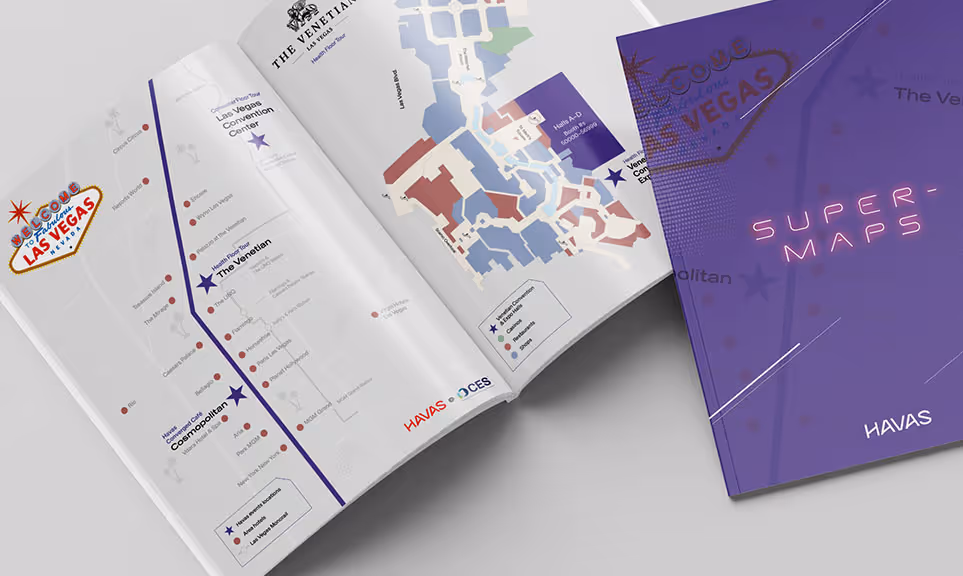 Open map booklet displaying venues and event locations for CES 2025 in Las Vegas, featuring The Venetian and Cosmopolitan hotels with a purple cover labeled 'Super-Maps' by HAVAS.
