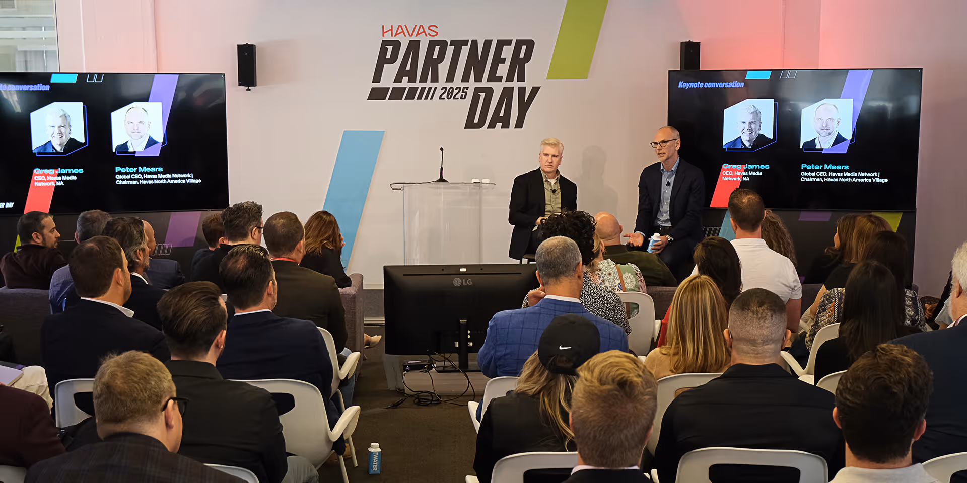 Audience watching two speakers on stage during Havas Partner Day 2025 keynote conversation.