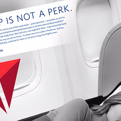 Partial view of a woman reclining in an airplane seat near a window with a Delta Air Lines logo and promotional text in the top left corner.