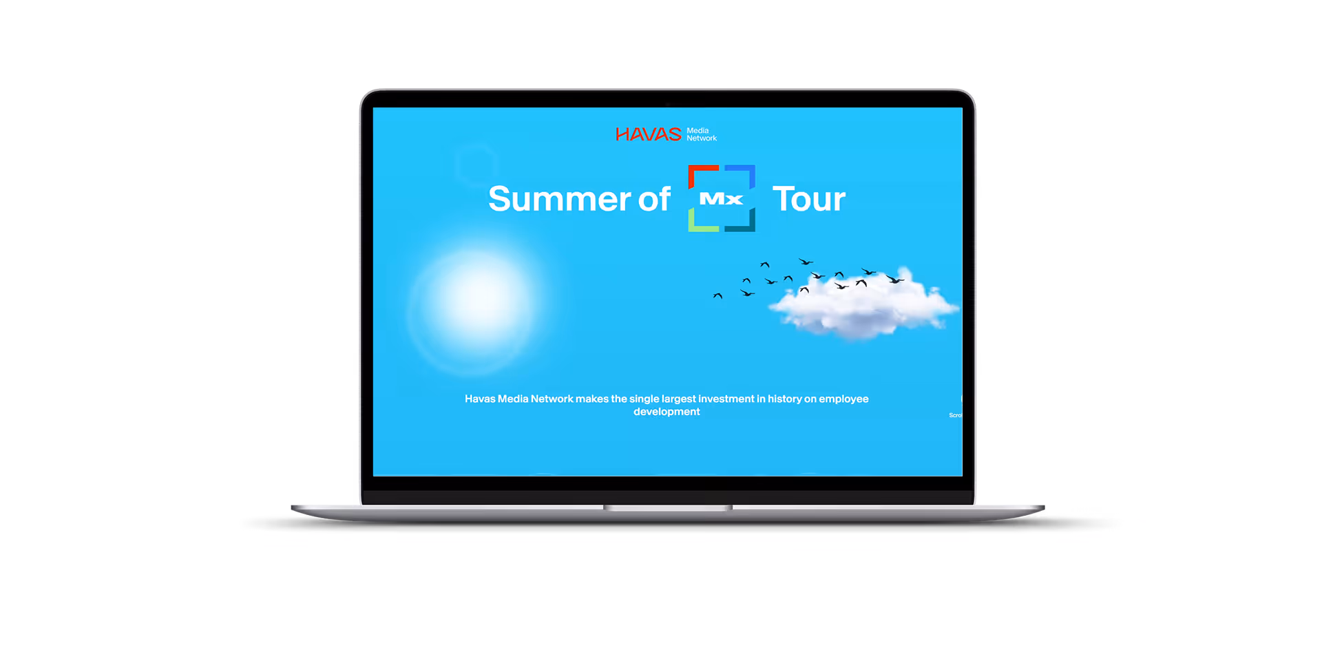 Laptop screen displaying 'Summer of Mx Tour' with Havas Media Network logo on a bright blue background featuring a sun, cloud, and flying birds.