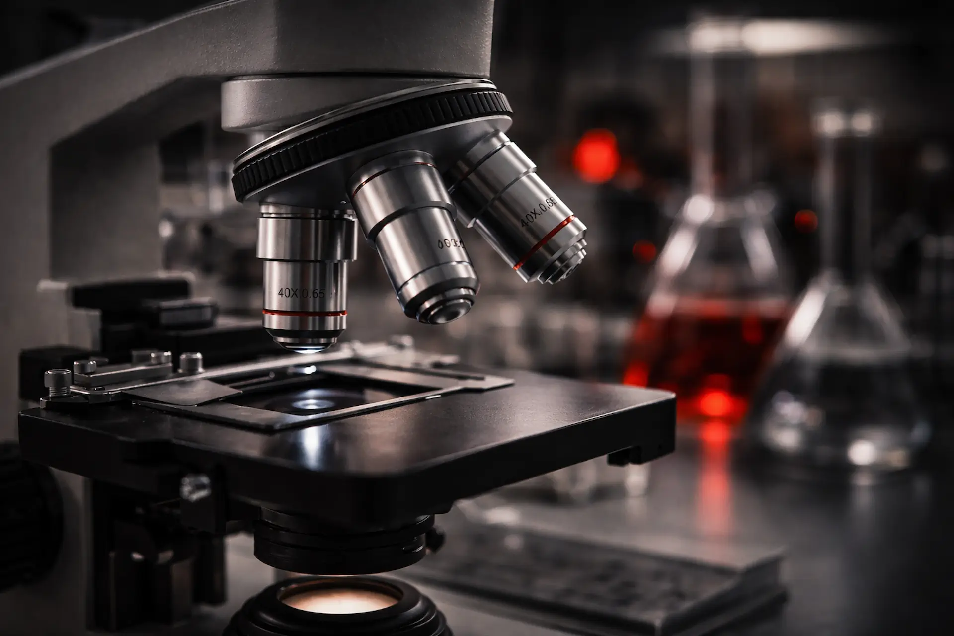 Laboratory microscope analyzing production chemistry samples
