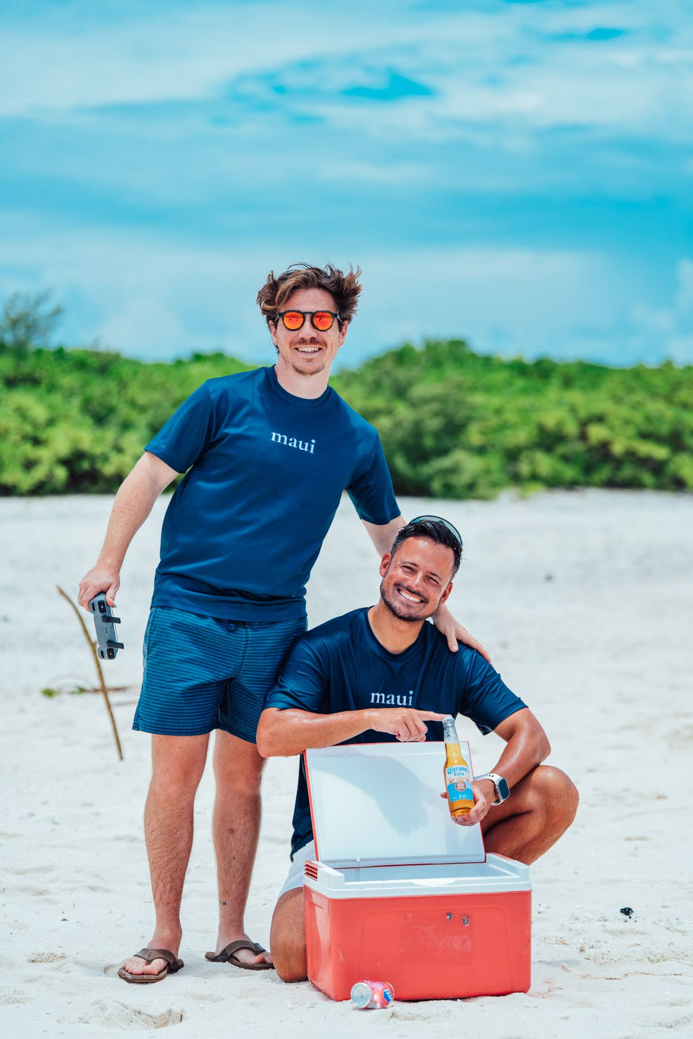 Two Maui expedition leaders on a beach in the Maldives