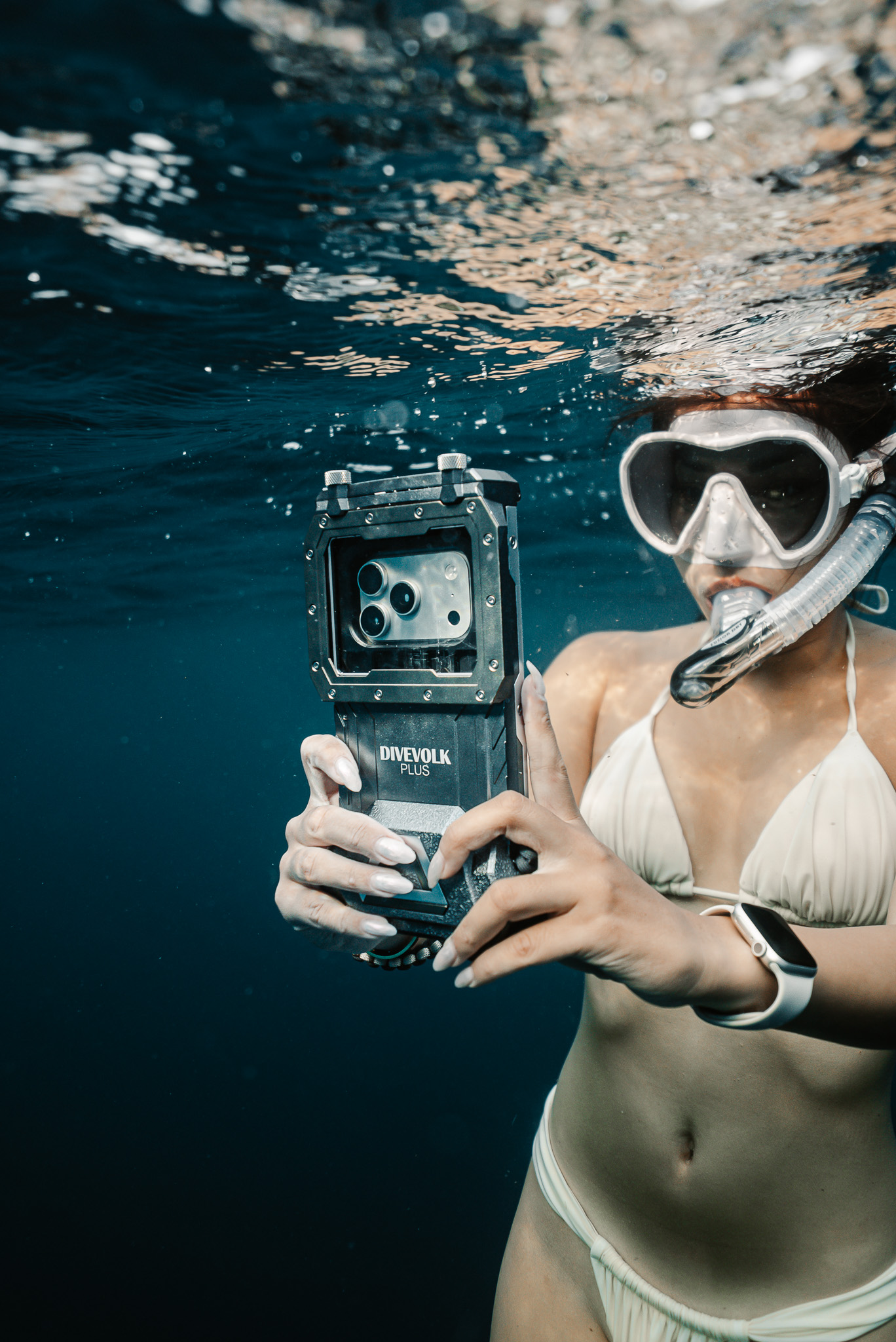 Maui leader in the water with a phone in an underwater housing