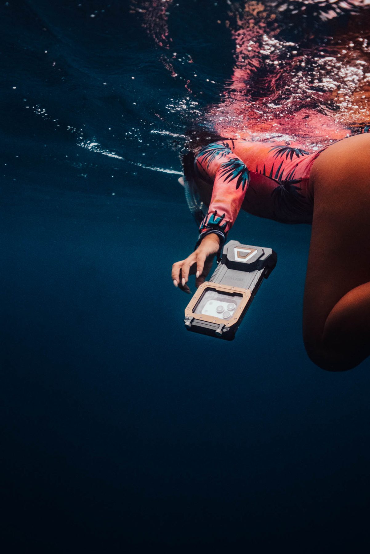 Swimmer filming with an iPhone in a DiveVolk housing at the surface