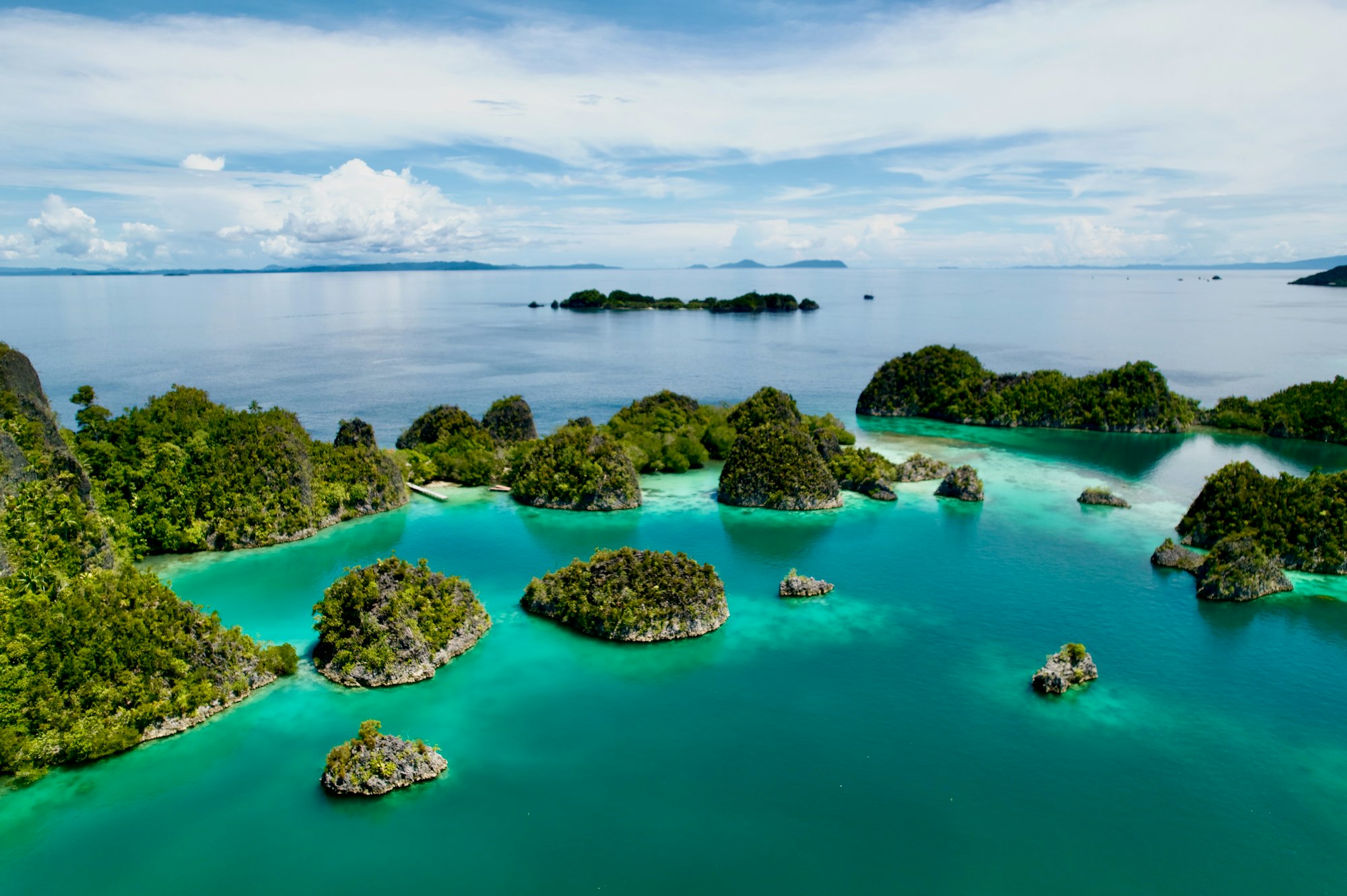 Islands and turquoise water in Raja Ampat, West Papua, Indonesia