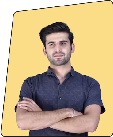 Confident young man with crossed arms wearing a dark shirt against a yellow background.