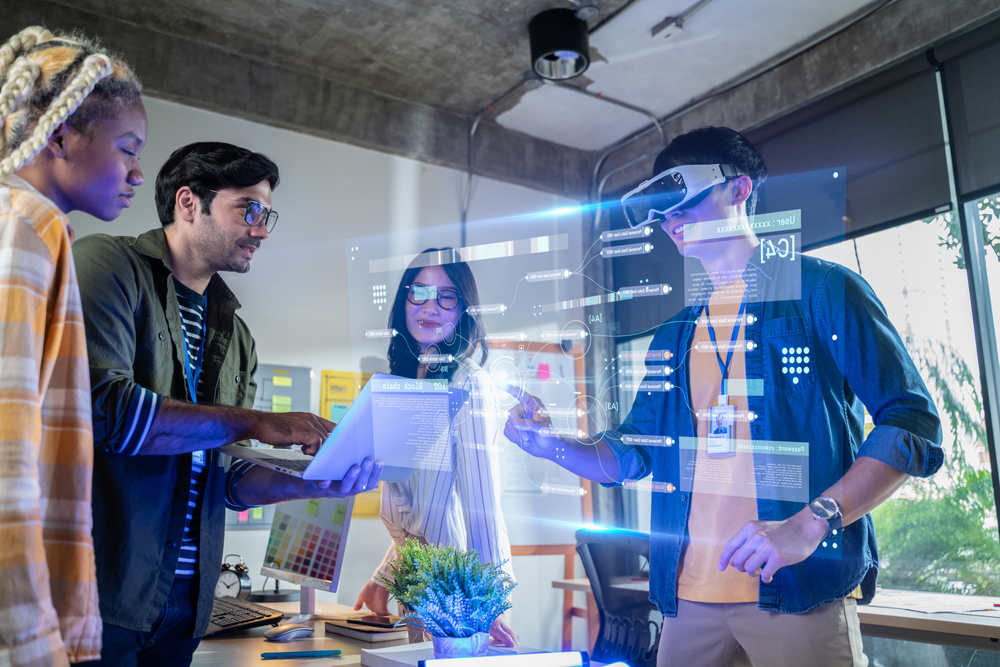 Team using VR technology in a modern workspace with SEO software on display.