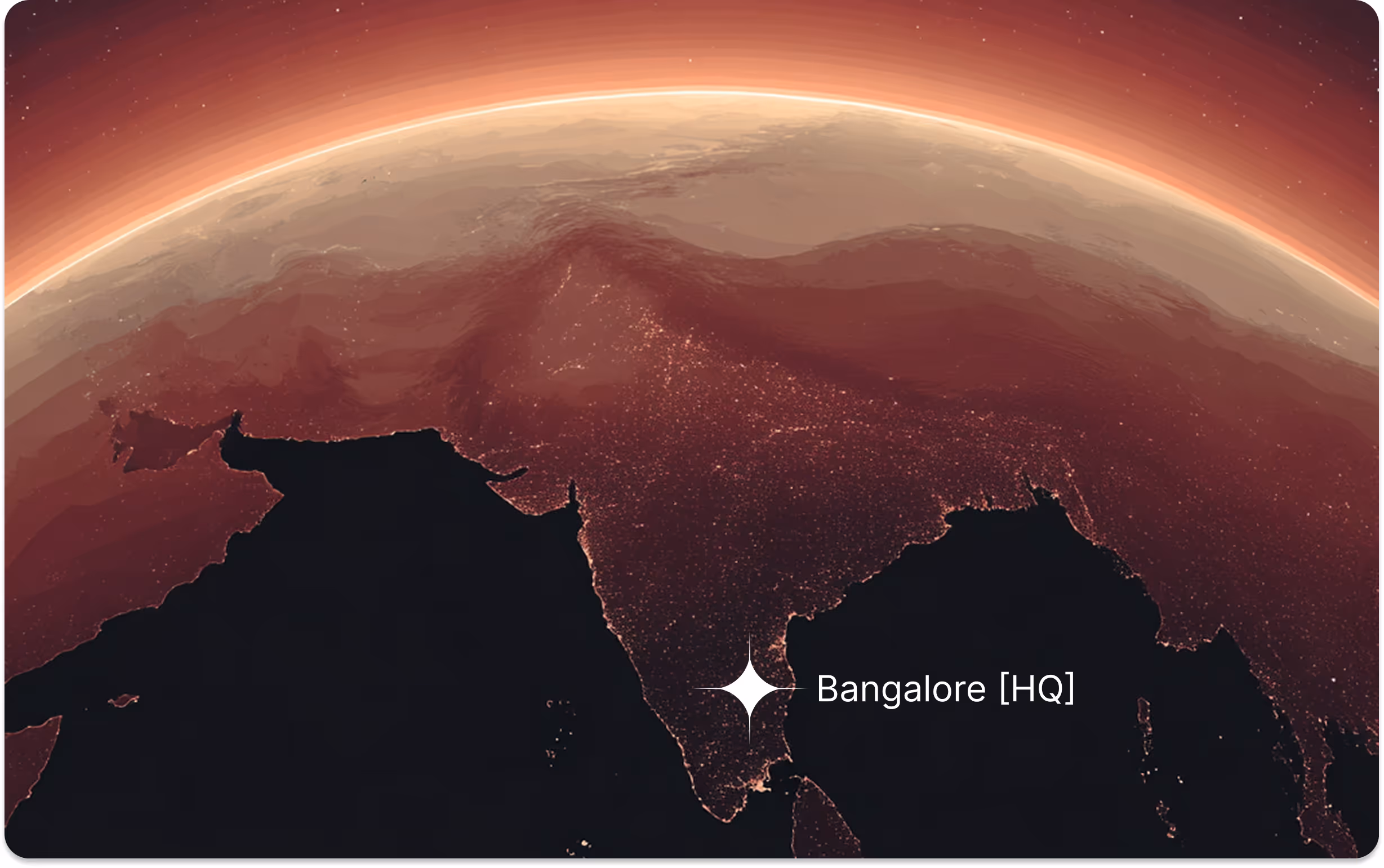 Satellite view of the Indian subcontinent at night with a bright star marking Bangalore labeled as HQ.